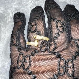 Adjustable Yellow Gold plated nail ring with cubic zirconia diamonds.